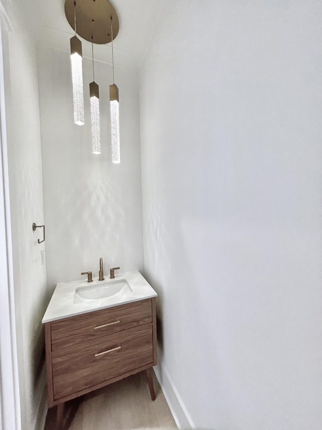 bathroom featuring vanity and baseboards