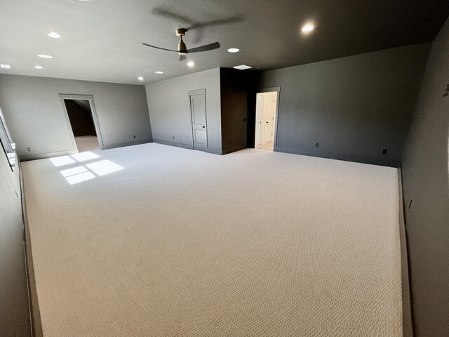 unfurnished bedroom featuring carpet flooring, recessed lighting, and baseboards