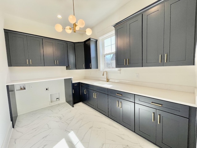 washroom featuring cabinet space, a sink, washer hookup, electric dryer hookup, and marble finish floor