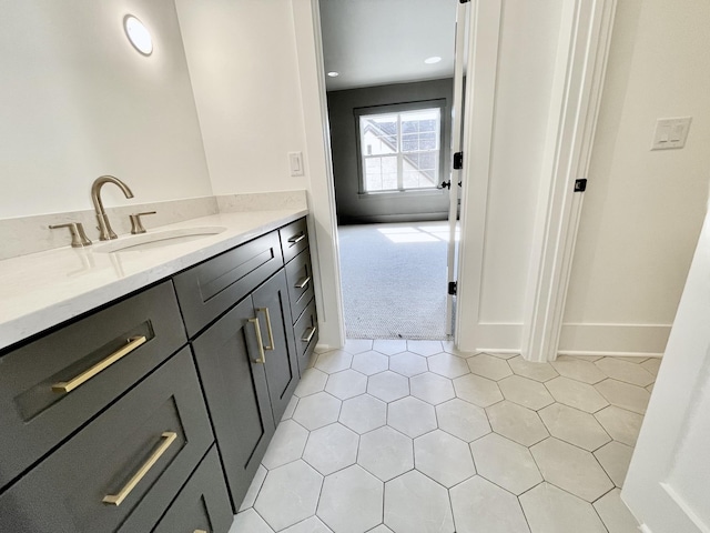 bathroom with baseboards and vanity