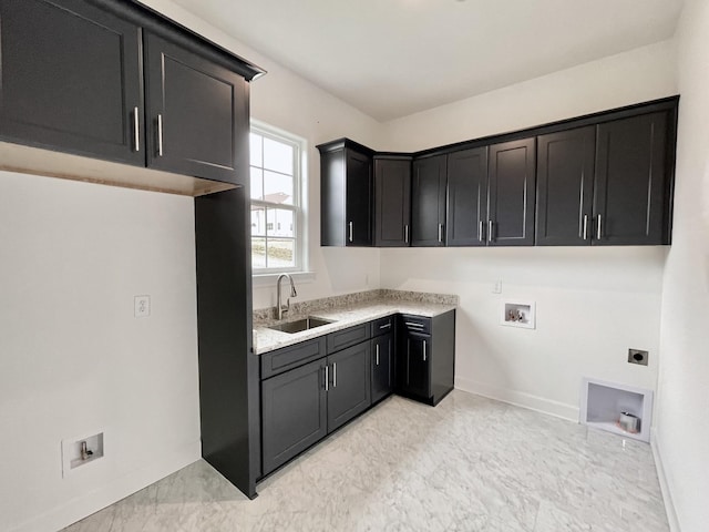 laundry area with a sink, cabinet space, baseboards, hookup for an electric dryer, and hookup for a washing machine