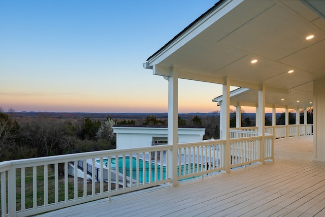 wooden terrace featuring an outdoor pool