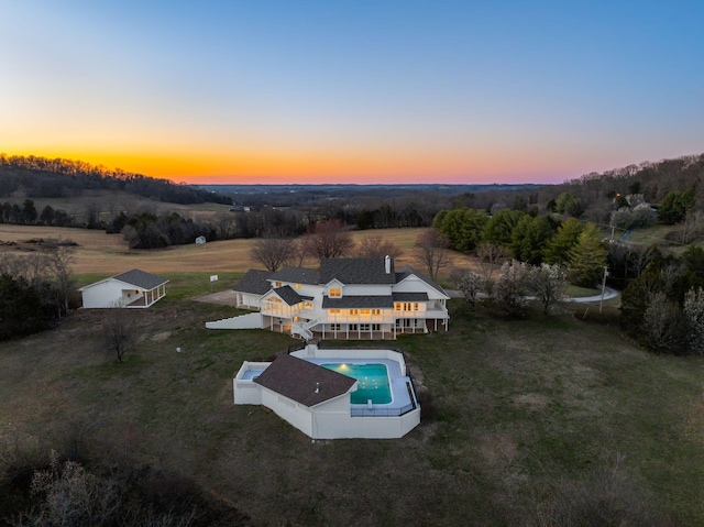 aerial view at dusk with a rural view