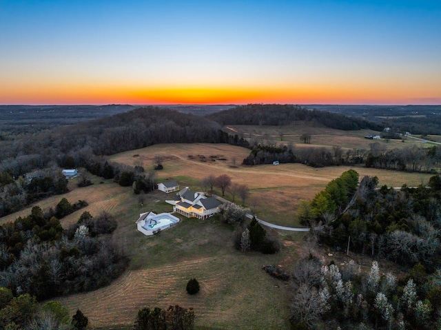 birds eye view of property with a rural view