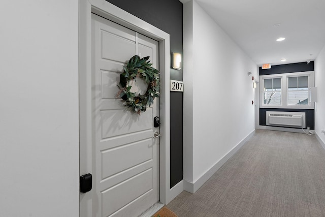 property entrance featuring an AC wall unit