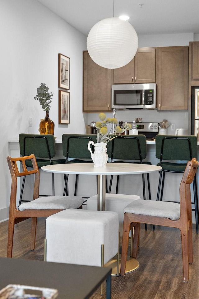 dining space featuring wood finished floors