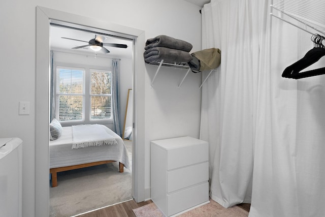 bedroom featuring ceiling fan and wood finished floors