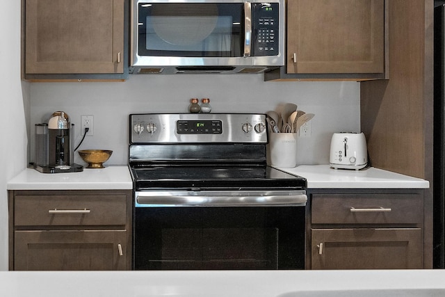 kitchen with stainless steel appliances and light countertops