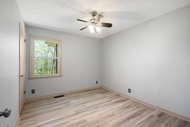 7704 Chester Rd, Fairview, TN 37062 - spare room featuring light wood-style floors, ceiling fan, and a textured ceiling