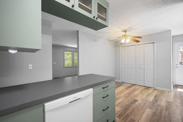 7704 Chester Rd, Fairview, TN 37062 - kitchen featuring dishwasher, green cabinetry, a textured ceiling, a ceiling fan, and dark countertops