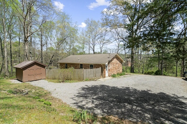 7704 Chester Rd, Fairview, TN 37062 - view of property exterior with a storage unit and driveway