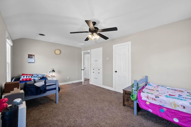 bedroom featuring visible vents, ceiling fan, baseboards, lofted ceiling, and carpet floors