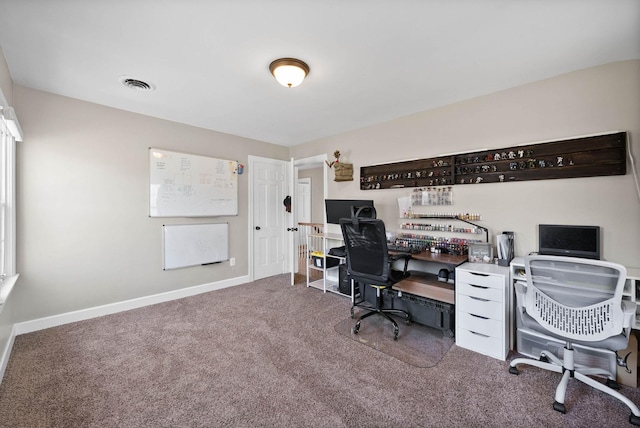 office with carpet, visible vents, and baseboards