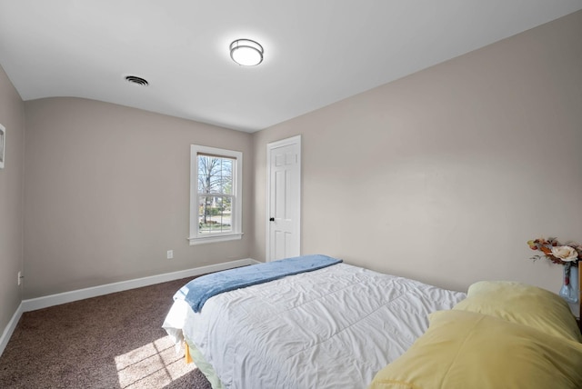 carpeted bedroom featuring visible vents and baseboards