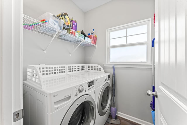 laundry area featuring laundry area, baseboards, and separate washer and dryer