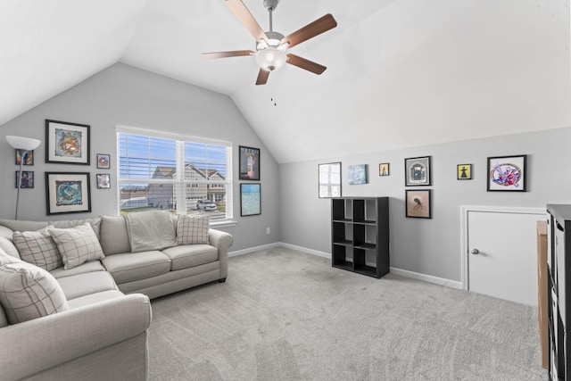 carpeted living area with baseboards, plenty of natural light, lofted ceiling, and a ceiling fan