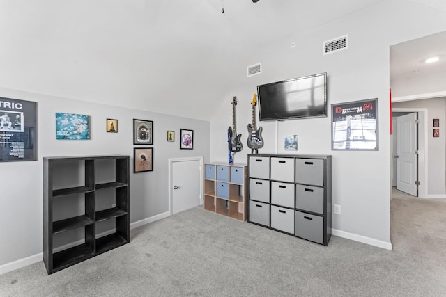 living room featuring lofted ceiling, carpet flooring, baseboards, and visible vents