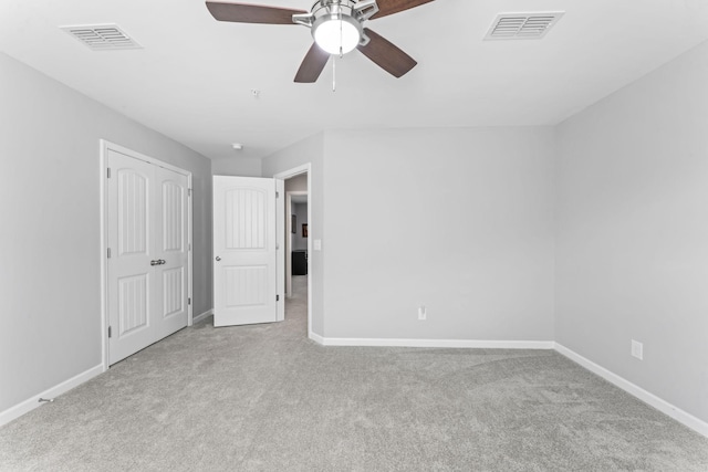 unfurnished bedroom featuring visible vents, baseboards, and carpet floors