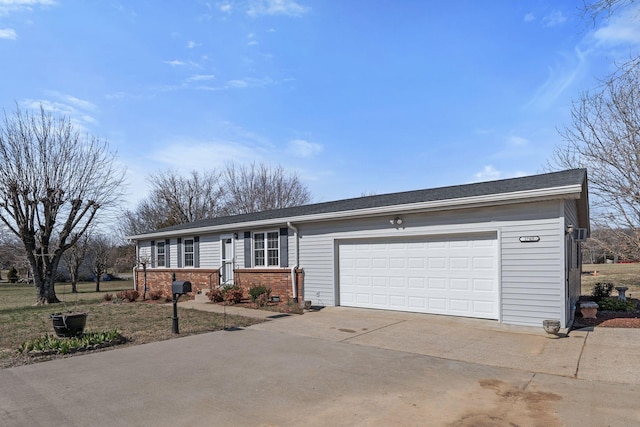 ranch-style home featuring brick siding, driveway, and an attached garage