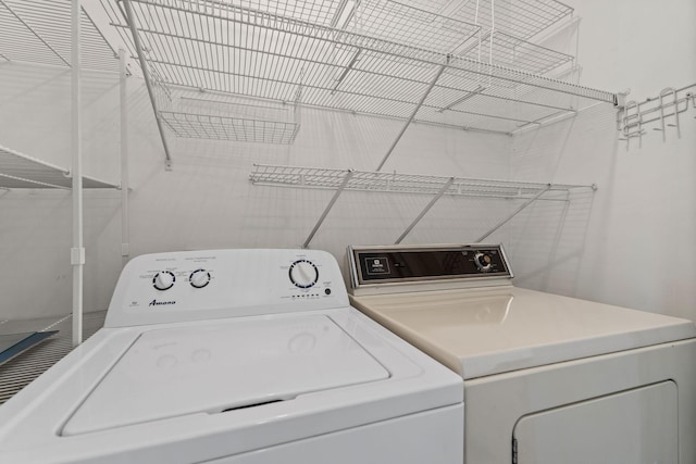 washroom featuring washer and dryer and laundry area