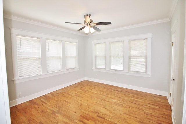 unfurnished room with baseboards, a ceiling fan, light wood-style flooring, and crown molding