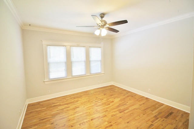 empty room featuring ceiling fan, light wood-type flooring, baseboards, and ornamental molding