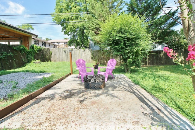 view of yard featuring an outdoor fire pit and a fenced backyard