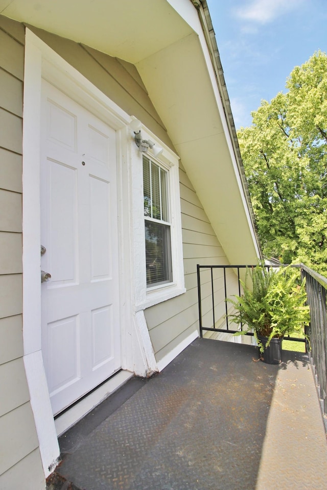 entrance to property with a balcony