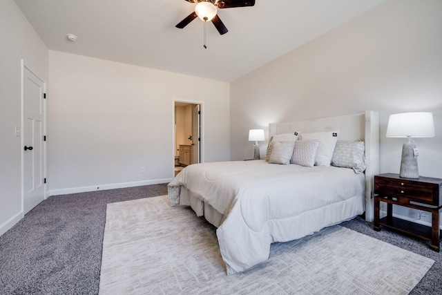 bedroom with baseboards, carpet, ensuite bath, and a ceiling fan