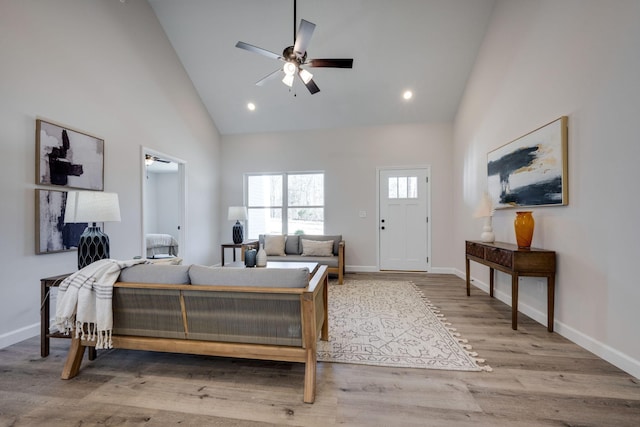 bedroom with recessed lighting, baseboards, high vaulted ceiling, and wood finished floors