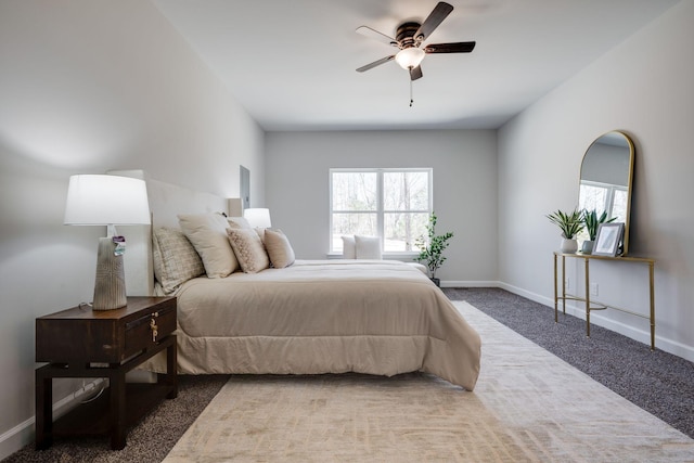 bedroom featuring multiple windows, carpet, and baseboards