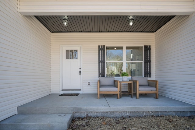 entrance to property featuring a porch