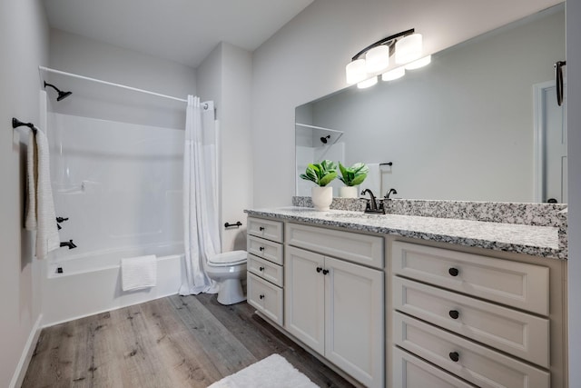 full bath with vanity, toilet, shower / bath combo with shower curtain, and wood finished floors