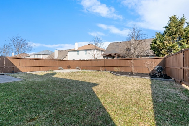 view of yard with a fenced backyard