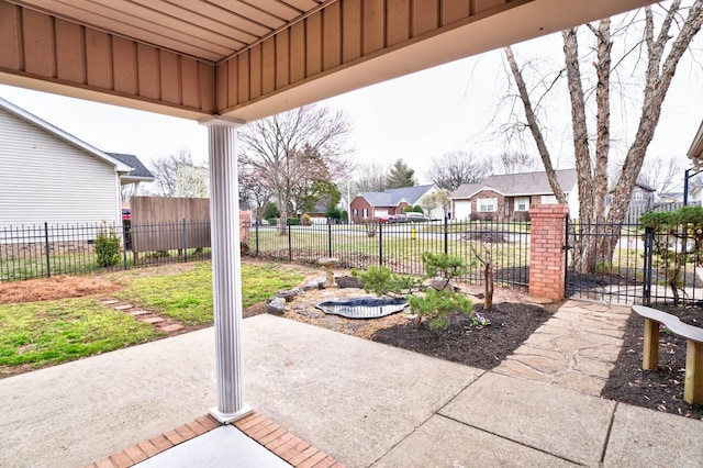 view of patio / terrace featuring a residential view and fence