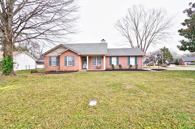 single story home featuring brick siding, a chimney, a front lawn, and fence