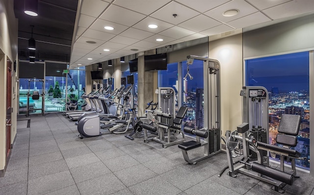 gym with a drop ceiling and recessed lighting