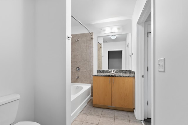 bathroom with tile patterned flooring, vanity, toilet, and shower / tub combination