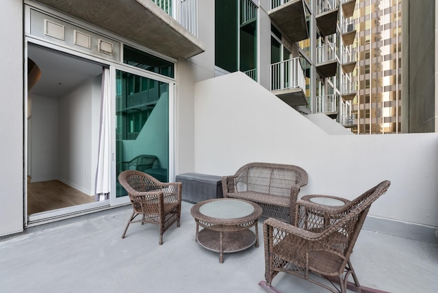 view of patio with a balcony