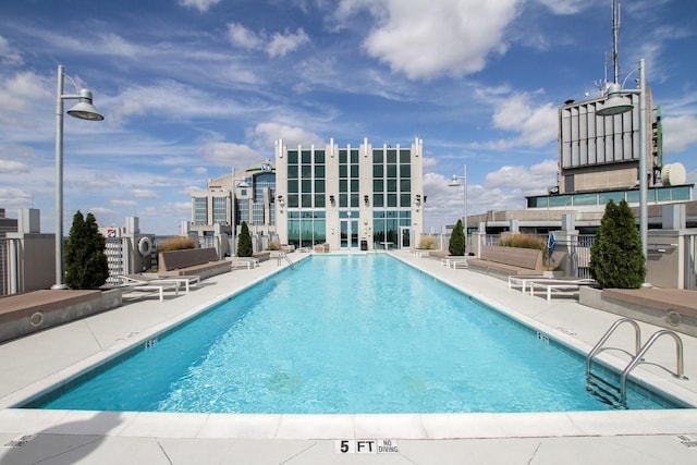 community pool with a patio