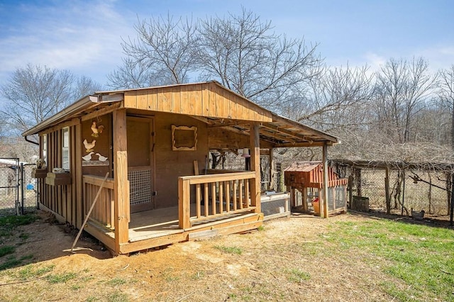 view of poultry coop featuring fence