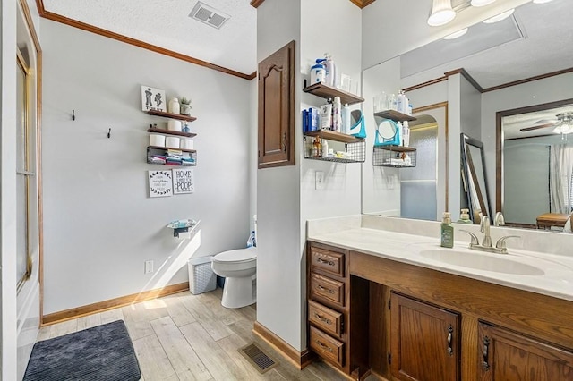 full bath with visible vents, toilet, crown molding, and wood finished floors