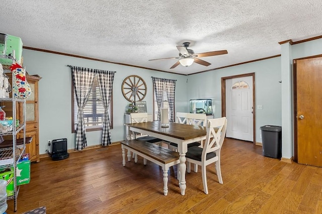 dining area featuring a ceiling fan, light wood-style floors, and ornamental molding