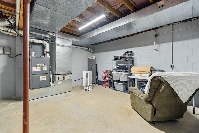 basement with heating unit and concrete block wall