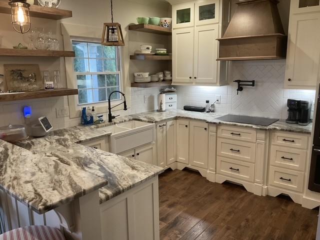 200 Marlin Rd, White House, TN 37188 - kitchen with black electric stovetop, premium range hood, a peninsula, white cabinets, and open shelves