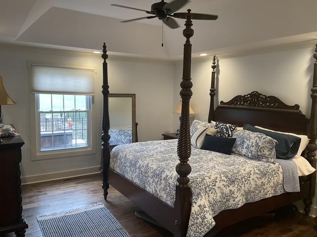 200 Marlin Rd, White House, TN 37188 - bedroom featuring ceiling fan, a tray ceiling, baseboards, and wood finished floors