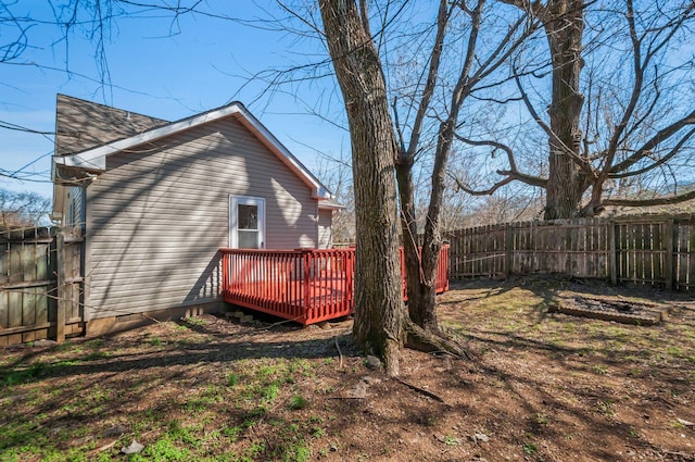 view of yard with a deck and a fenced backyard