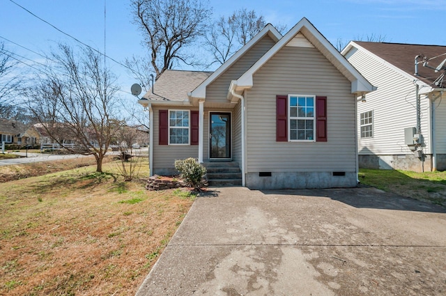 view of front of property with crawl space, entry steps, a front lawn, and a shingled roof