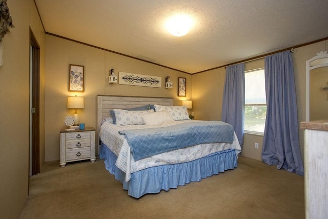 bedroom featuring crown molding, carpet floors, and a textured ceiling