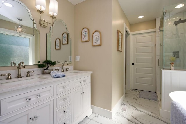 bathroom featuring double vanity, a stall shower, marble finish floor, and a sink